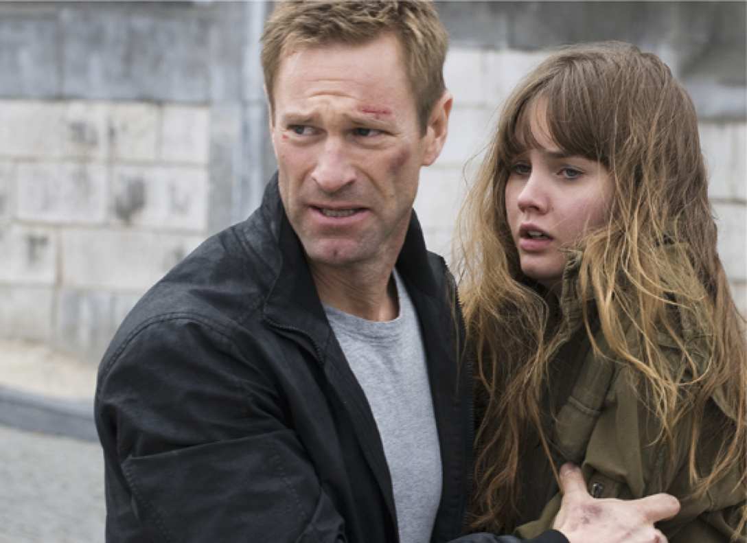 Aaron Eckhart and Liana Liberato in The Expatriate