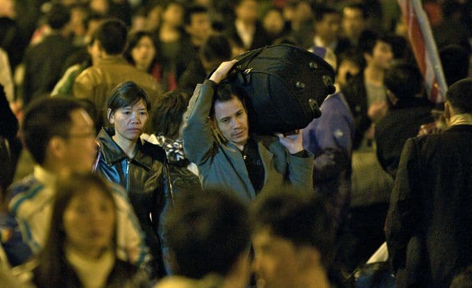 Chen Suqin and Zhang Changhua at the Guangzhou Railway Station, Last Train Home