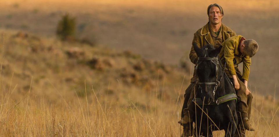 Jon Jensen (Mads Mikkelsen) carries his dead son (Toke Lars Bjarke) in The Salvation