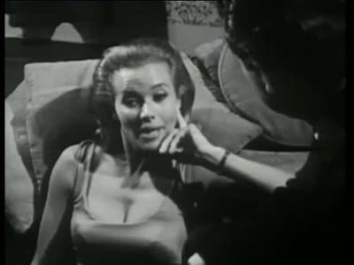 Cathy Gale in low cut dress