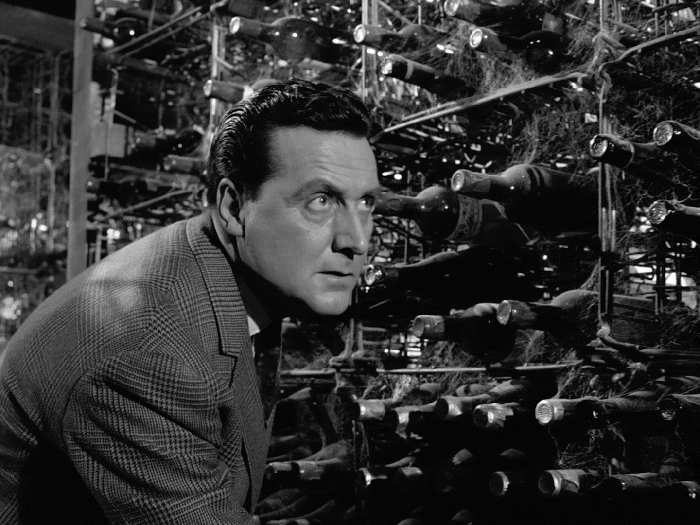 John Steed in a wine cellar