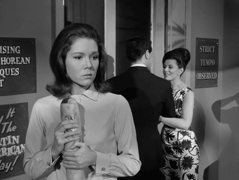 Mrs Peel listens in as John Steed is spirited away