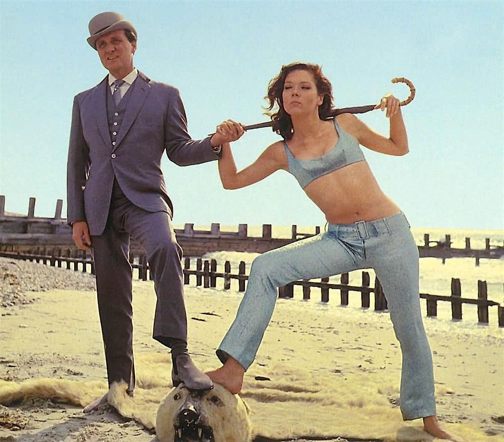 Publicity shot of John Steed and Emma Peel on a beach
