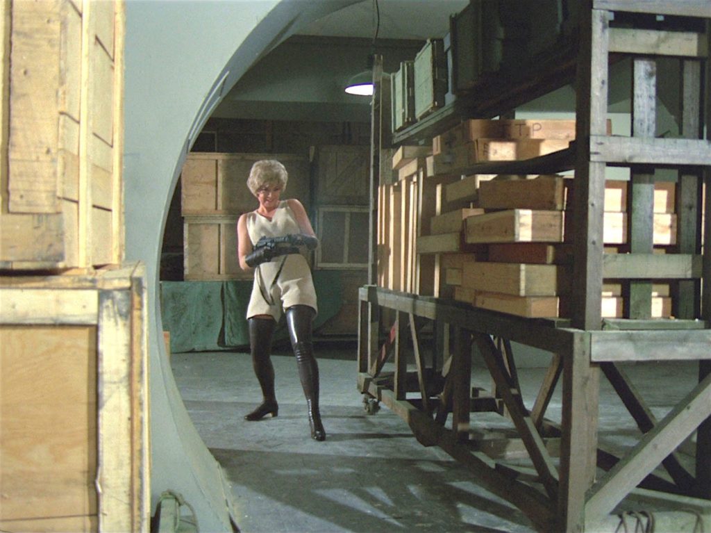 Tara King with sub machinegun