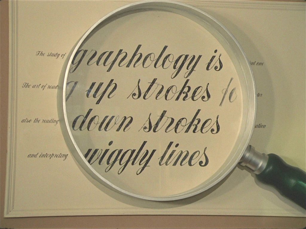 Some handwriting under a magnifying glass